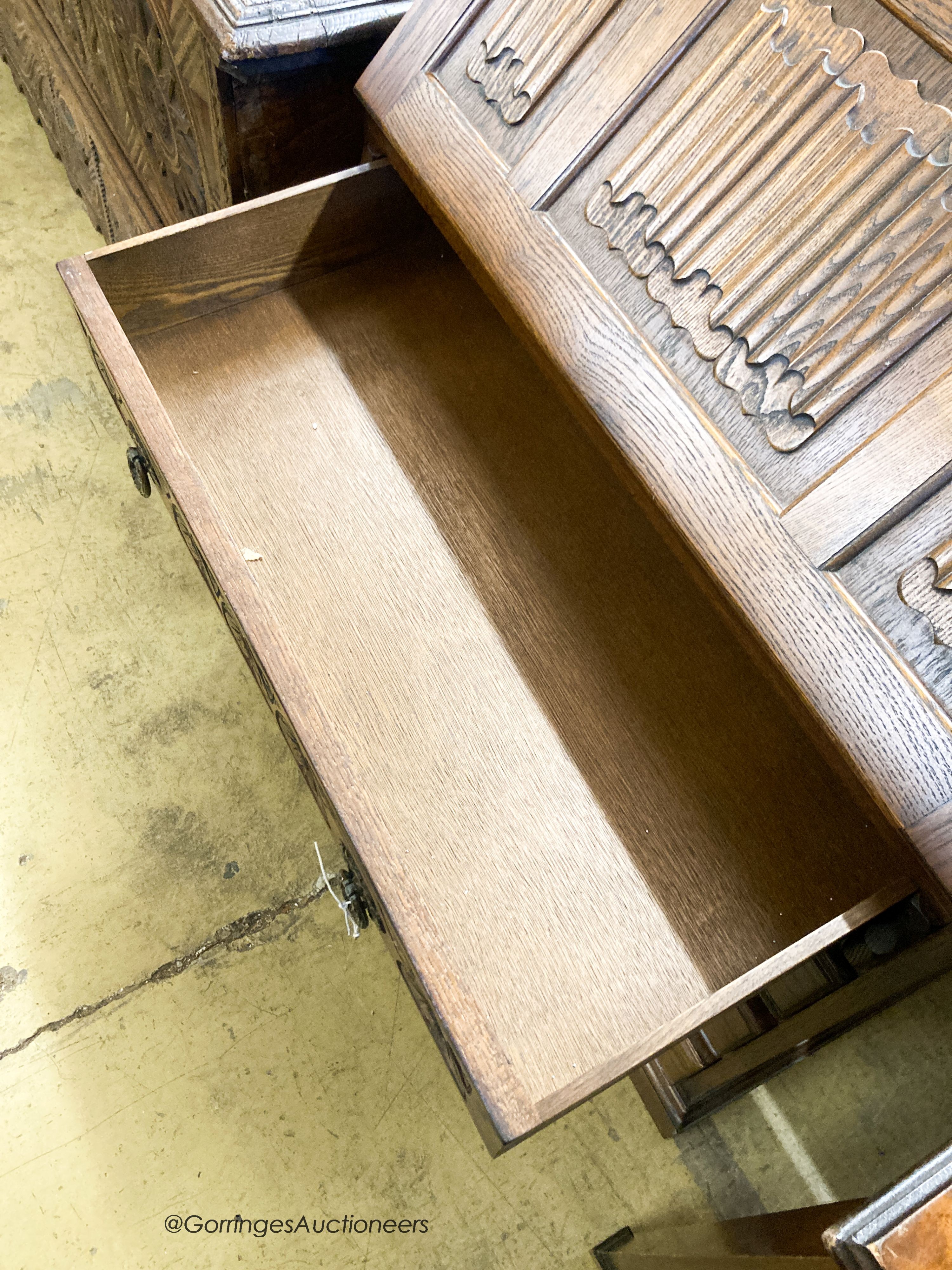 A reproduction oak linenfold carved bureau, W.75cm D.48cm H.99cm